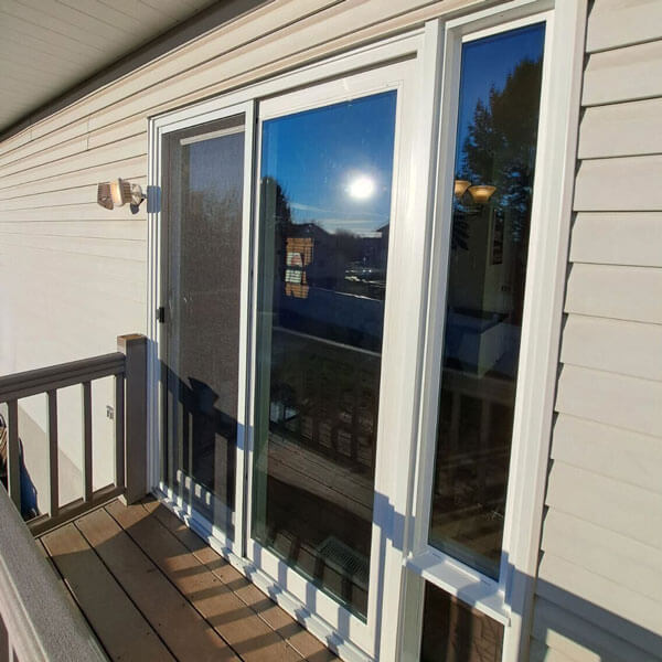Sliding glass door of a house with a balcony and sunny weather outside in Mechanicsburg, PA