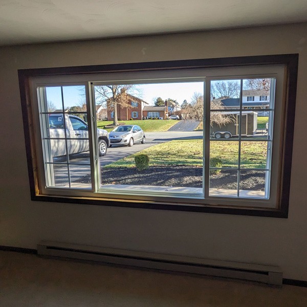 Slider window on a house in Mechanicsburg, PA, with a car parked outside